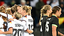Germany celebrate after their fourth goal against the Matildas.