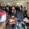 People turn out for the auction of a six-bedroom, five-bathroom home at 116 Belvedere Crescent, Sunnybank Hills.