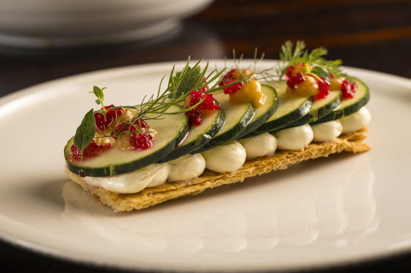 The zucchini tart, featuring citrus-cured zucchini atop flaky pastry, is miraculously vegan.
