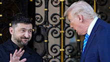 President Donald Trump greets Ukraine’s President Volodymyr Zelensky at his Mar-a-Lago club, on Sunday