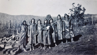 Come rain or shine - Necia Combe (far left) in the Australian Women's Land Army at Batlow.