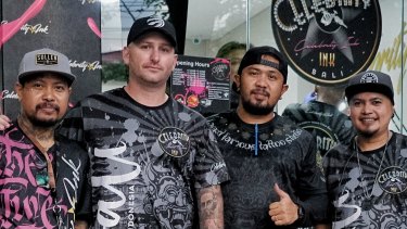 Dane Herden, owner of Celebrity Ink Tattoo Bali studio (2nd from left) with Gede Supala (Left) and some of the studio's senior tattoo artists.
