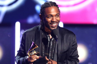 Kendrick Lamar accepting the 2018 Grammy Award for best rap album.