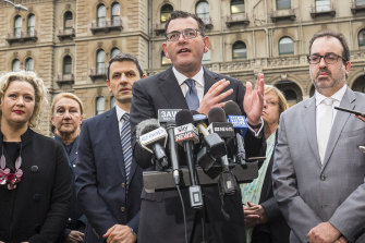 Daniel Andrews (centre) with Martin Pakula (right) and Lisa Neville (second from left) in 2018.