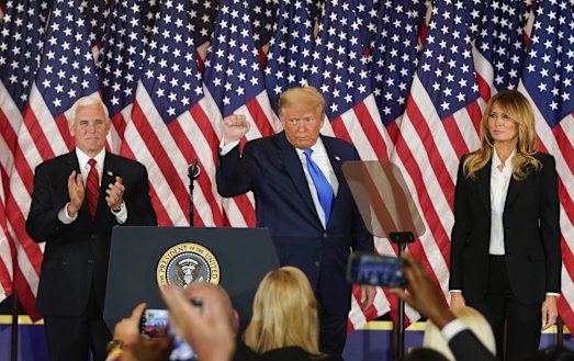 Donald Trump addresses supporters in the White House at an election night party.
