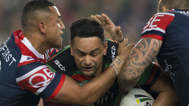 No way through: John Sutton is squeezed on a night highlighted by an impenetrable Roosters defence.