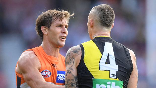 Hammer and tong: Dustin Martin scuffles with Matt de Boer.