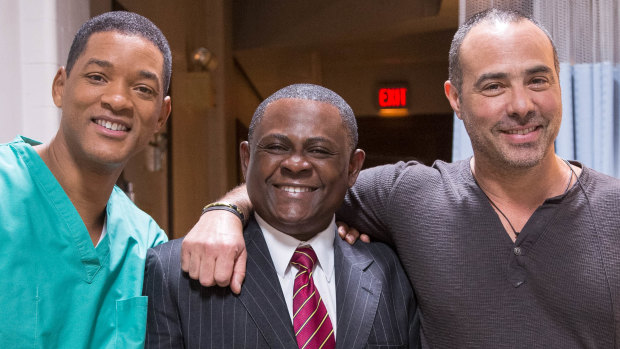 Dr Bennet Omalu with Will Smith, left, who portrayed him in the movie Concussion, and the film's director, Peter Landesman.