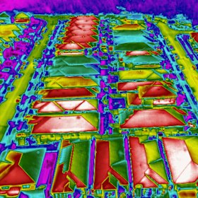 Infrared images show the high temperatures generated by dark roofs in density housing.