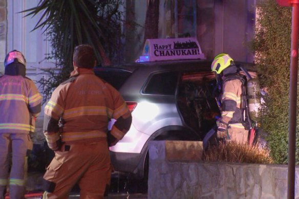 Firefighters at the scene of the car fire in St Kilda East early on Christmas Day.