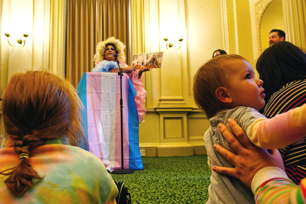 Drag queen Frock Hudson reads for young children and their families at Parliament House on Wednesday.