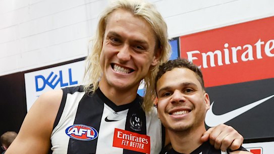 Bobby Hill with skipper Darcy Moore in the Collingwood rooms after the victory that sent them to a preliminary final.