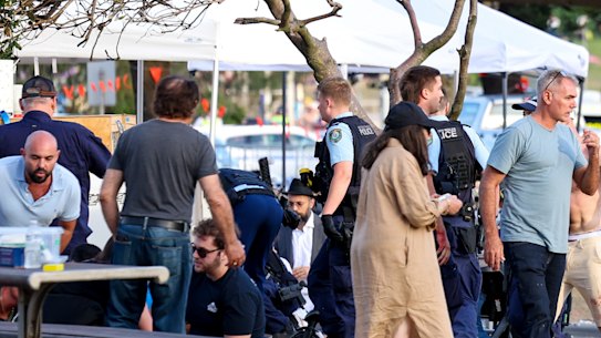 Police attend to those at the Hanukkah event in the moments after the shooting.