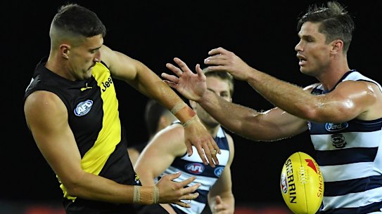 Tough contest: Richmand ruckman Ivan Soldo takes on Geelong big man Tom Hawkins at Metricon Stadium.
