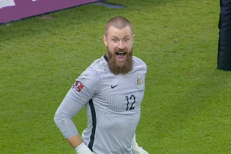 Goalkeeper Andrew Redmayne celebrates after making the crucial save in the penalty shootout against Peru.