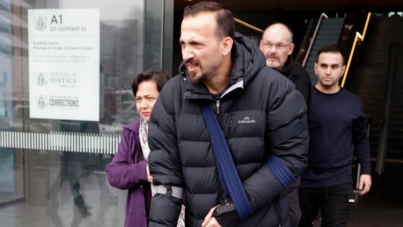 Temel Atacocugu, a victim of the Christchurch mosque shootings, leaves court in Christchurch last year.