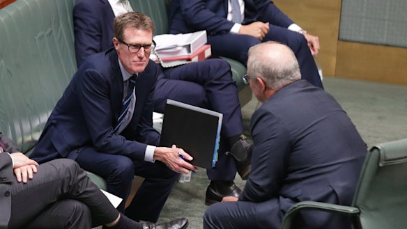 Attorney-General Christian Porter speaks with Prime Minister Scott Morrison on Tuesday.