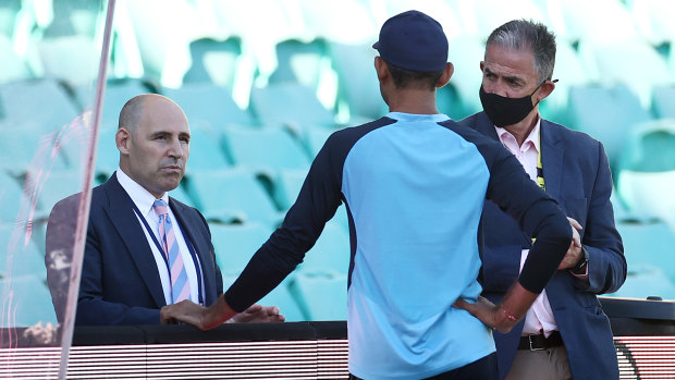 Nick Hockley and Sean Carrol talk to India team management at the SCG in January. 