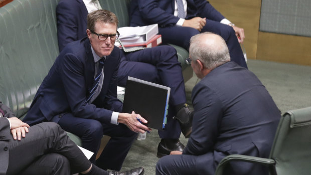 Attorney-General Christian Porter speaks with Prime Minister Scott Morrison on Tuesday.