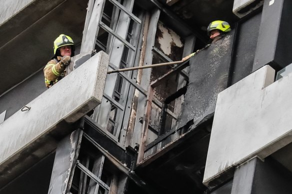 Firefighters survey the damage on the Neo 200 tower block in Melbourne’s Spencer Street in 2019.