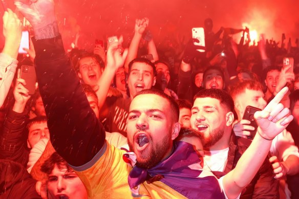 Fans celebrate at Federation Square as they watch Australia’s 1-0 win over Denmark at the World Cup on Thursday