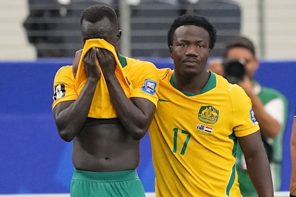 Nestory Irankunda of Australia hugging his teammate Awer Mabil after losing.