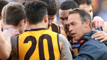 Happy as a Hawk: Alastair Clarkson revs up his players.
