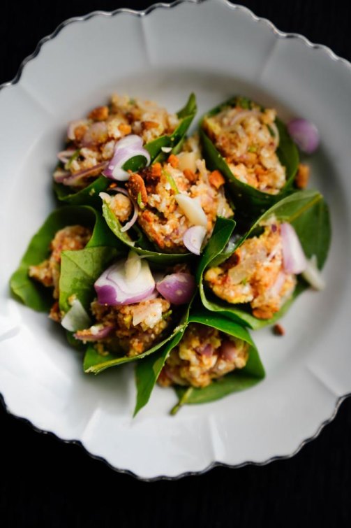 Miang kham, the one-bite wrap served on a betel leaf.