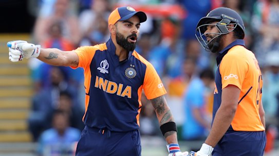 Unimpressed: India captain Virat Kohli speaks with Rohit Sharma after hitting a four against England. He called the short boundary at Edgbaston that played into the hands of the home side "bizarre".