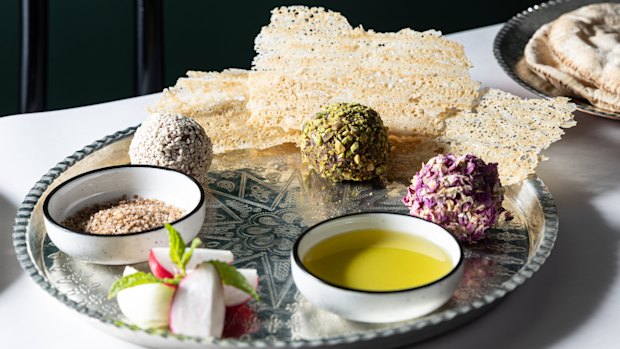 Lamb naye balls coated with sesame seeds, crushed pistachio and dried rose petals.