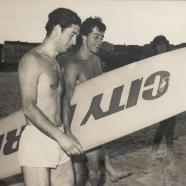 Prince Charles at Bondi in 1977, alongside a surfboard emblazoned with the name of Nick Politis’ car dealership.