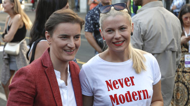 Serbian Prime Minister Ana Brnabic, left, and her partner Milica Djurdjic participate in the annual pride march in Belgrade, Serbia.