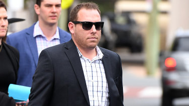 Former Dreamworld employee Joe Stenning leaves after giving evidence in the inquest.