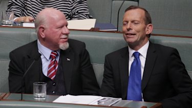 Dr Mal Washer (left) lobbied his party, under then-opposition leader Tony Abbott, to support the plain packaging rules.