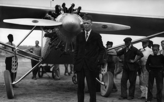 Aviator Charles A.  Lindbergh stands in front of his plane "The Spirit of St.  Louis" in New York, in May 1927, before his historic solo flight to Paris. 