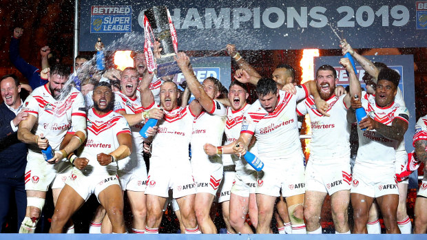 Roosters next: St Helens players celebrate with the Super League trophy after beating Salford Red Devils at Old Trafford.
