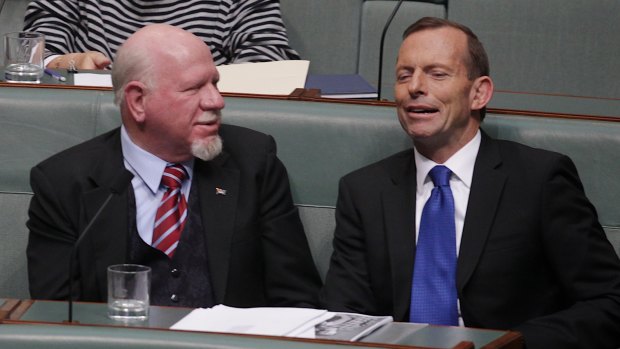 Dr Mal Washer (left) lobbied his party, under then-opposition leader Tony Abbott, to support the plain packaging rules.