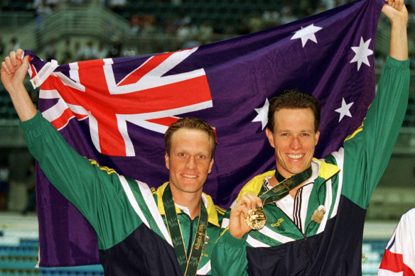 Perkins (right) and Daniel Kowalski celebrate an Australian one-two in the 1500m at the Atlanta Olympics.