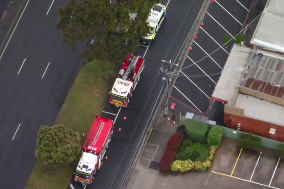The view from the air as emergency services personnel attend Mr Andrews’ office.