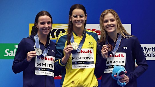 Australian Kaylee McKeown (centre) after one of her victories over American Regan Smith.