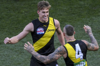 Good times: Tom Lynch and Dustin Martin celebrate.