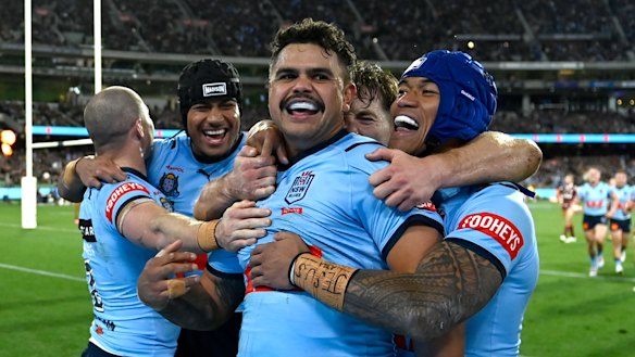 Latrell Mitchell and the Blues celebrate another try.