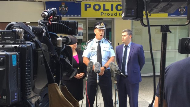 Paul Taylor, pictured with Police Minister Mark Ryan and Education Minister Grace Grace. 