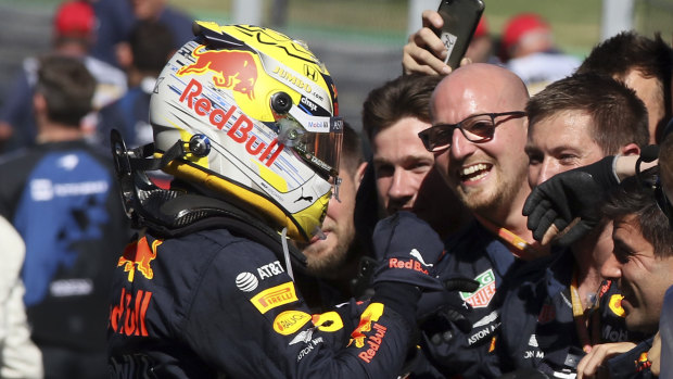 Victory intact: Red Bull driver Max Verstappen of the Netherlands celebrates with his team after winning the Austrian Grand Prix at Spielberg.