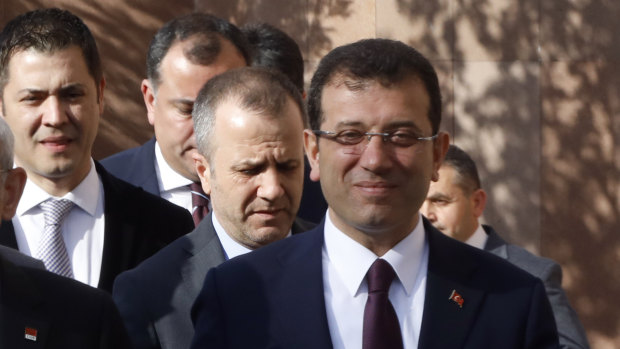 Ekrem Imamoglu, the main Turkish opposition Republican People's Party candidate for Istanbul, right, arrives to address supporters in Ankara in April.