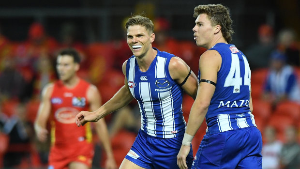 On point: Mason Wood (centre) showed glimpses of top form for the Roos during loss to the Suns.