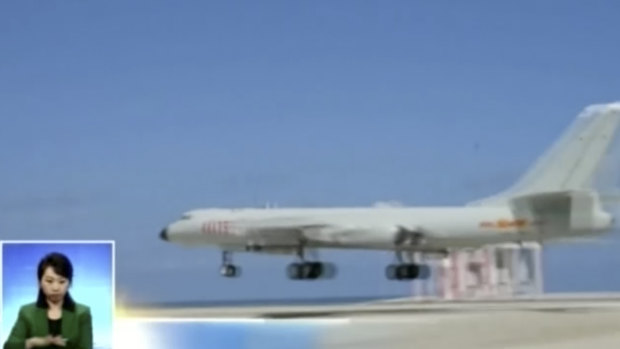 A Chinese H-6K bomber flying along a runway in the South China Sea. 