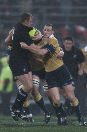 Scott Robertson getting smashed as an All Black in 2002.