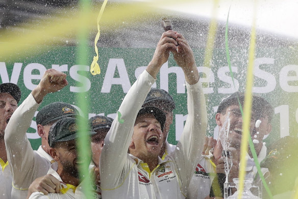 Tim Paine with the Ashes urn.