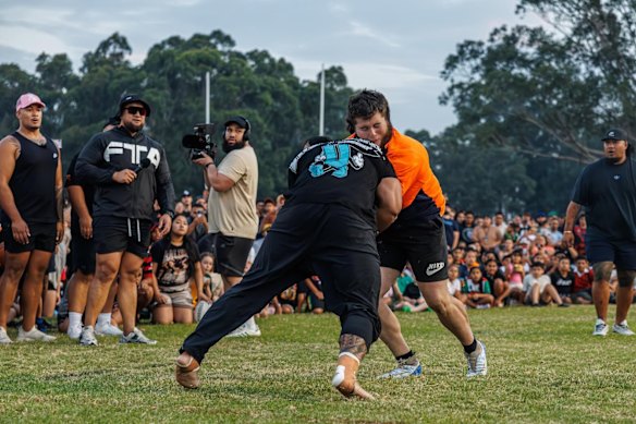 Andrew Alauni (left, in black shirt), competes at a Run It Straight event.  